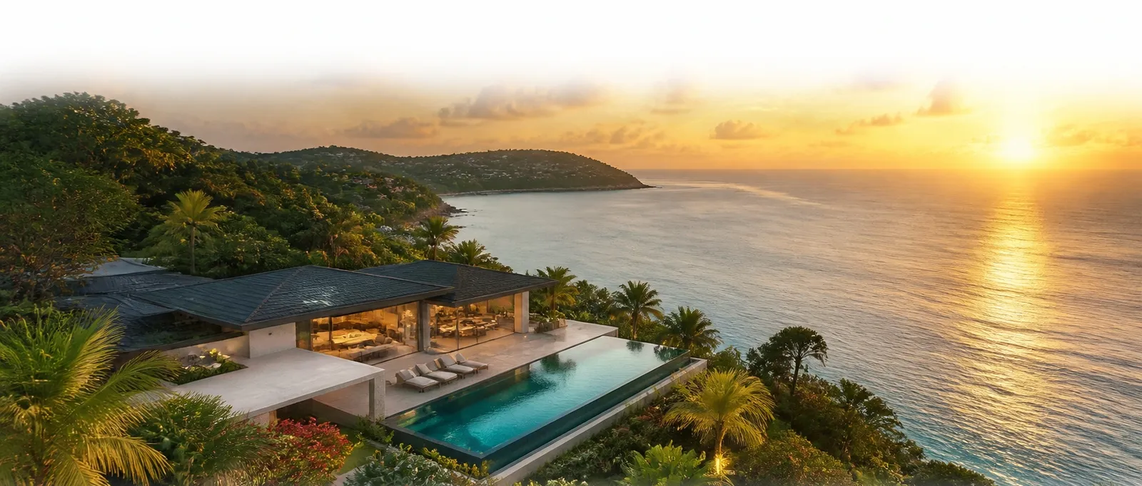 Vue aérienne d'une villa face à la mer au coucher du soleil